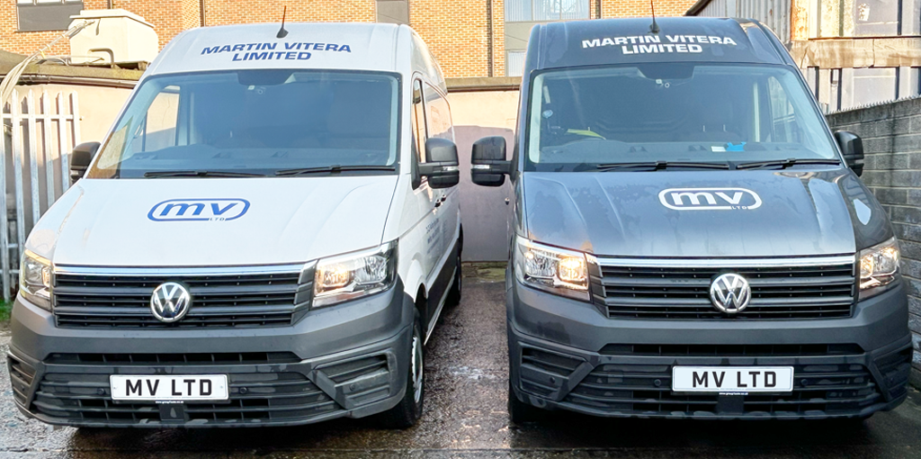 2 Martin Vitera branded vans, front on